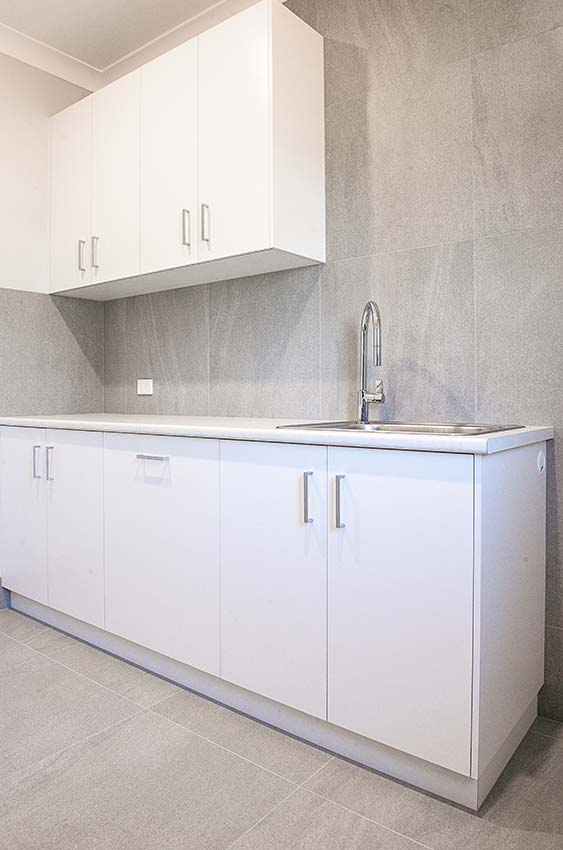 Laundry cabinets sink tap cabinetry